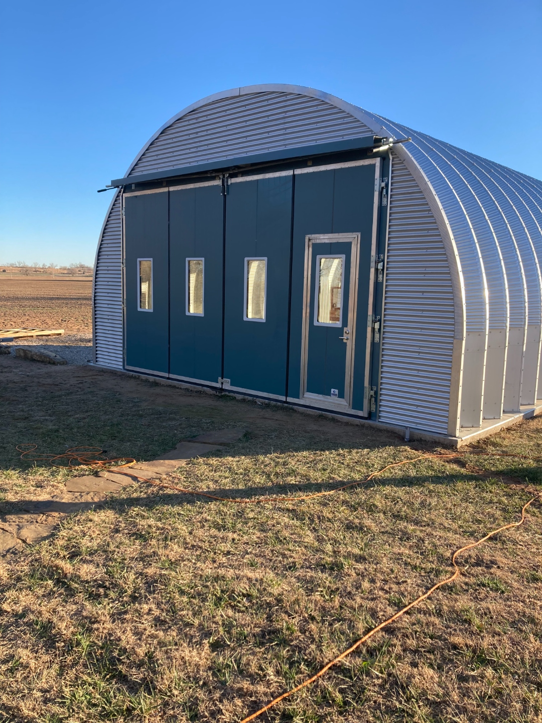 S Series compact building with dark blue sliding doors